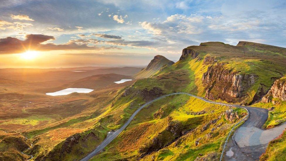 A dramatic castle overlooking a loch in the Scottish Highlands